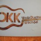 Logo OKKWola, Tadeusz Ciuraba - praca w słomie